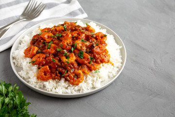 Homemade Cuban Shrimp Creole on a Plate on a gray surface, side view.