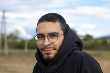 young man from front smiling