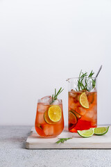 Watermelon and lime punch. Colorful cocktails in glasses on white table.  Fresh holiday drinks.