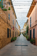 Obraz premium Narrow street with colorful houses in old town, Alcudia, Mallorca, Spain.