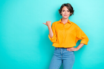 Portrait photo of young adorable pretty nice girl wear colorful shirt finger directing empty space...