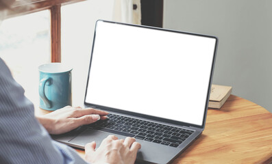 Fototapeta premium Close-up, Business woman using portable laptop computer at her desk. Laptop blank screen mockup