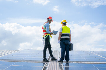 Technician inspection and repair solar cell on the roof of factory,Service check installation solar...