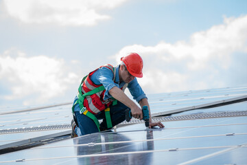 Fototapeta na wymiar Electrical and instrument technician installation and maintenance electric system solar panel on the roof of factory,Service check installation solar cell.