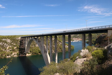 Fototapeta na wymiar City of Skradin. Road bridge over the Krka River in Croatia.