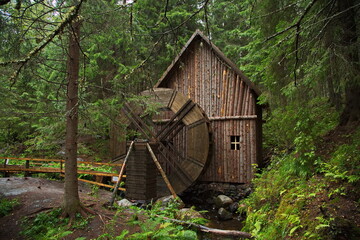 Water mill on a mountain stream in the Karelian forest.