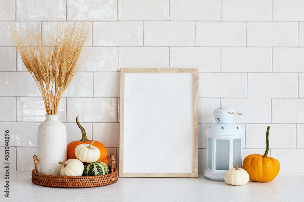 Sticker autumn still life. picture frame mockup, tray with vase of dry wheat, decorative pumpkins, lamp on w