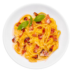 Pasta with bacon and basil on white plate
