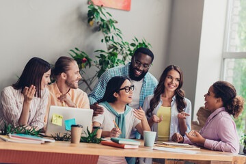Photo of good mood businesspeople discussing new startup indoors workstation workshop restroom