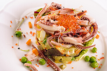 Salad with seafood, octopus and red caviar