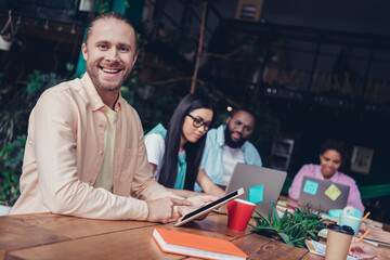 Photo of cute positive businesspeople typing modern devices indoors workstation workshop restroom