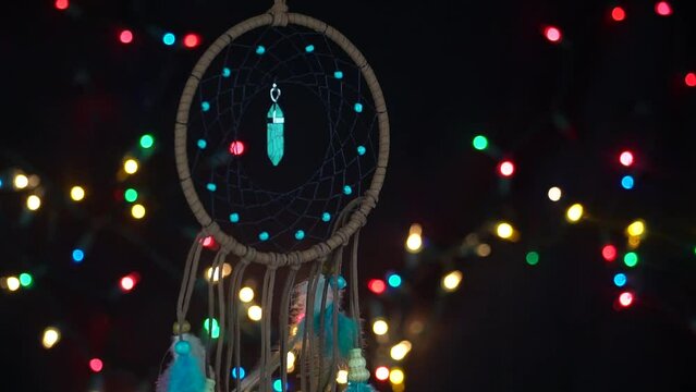 Spiritual mystical dream catcher with a star like lights in the background