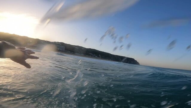 POV Man Surfing Ocean Wave, Extreme Sport HD Slow Motion. Surfer on Blue Ocean Wave Getting Barrelled. Praia Grande in Sintra.
