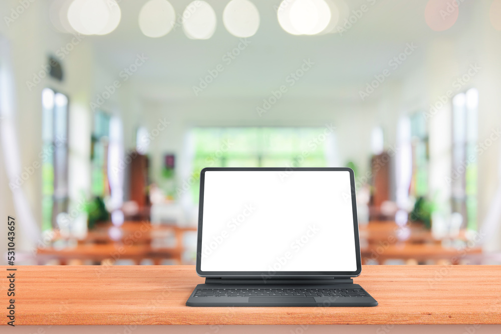 Leinwandbilder digital tablet mock up placed on wooden table in blurred coffee shop or restaurant for menu or order