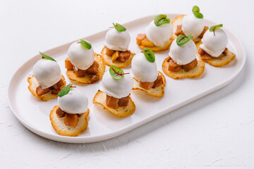 Italian style appetizer on white plate