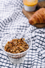Delicious breakfast with granola and croissant