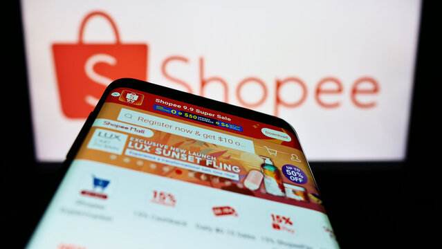 Stuttgart, Germany - 09-10-2022: Mobile phone with website of Singaporean e-commerce company Shopee on screen in front of business logo. Focus on top-left of phone display.
