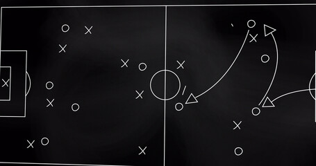 Image of game plan on board over sports stadium