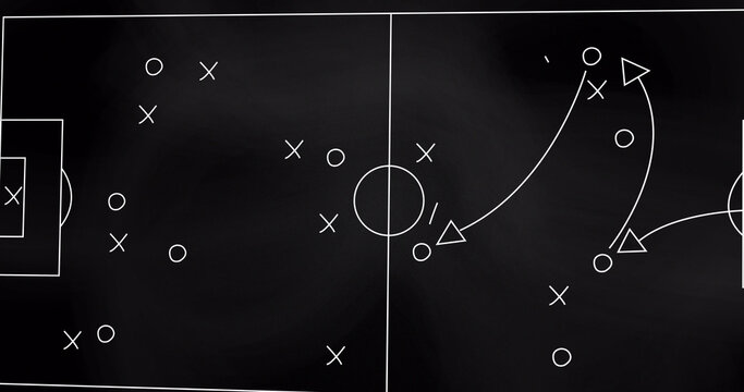 Image of game plan on board over sports stadium