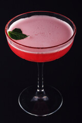 Red, sweet berry cocktail with froth