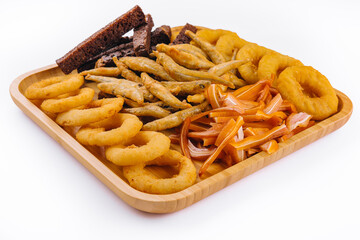 onion rings, fried smelt, pork ears on board