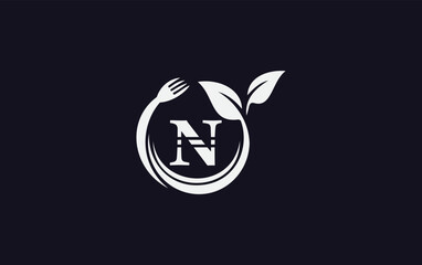 Naklejka premium Green leaf nature with spoon and healthy logo design vector spoon fork and leaf