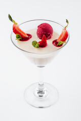 Italian dessert panna cotta with red fresh strawberries