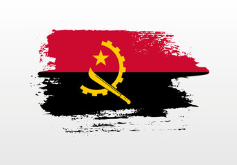 Modern style brush painted splash flag of Angola with solid background