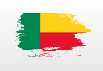 Obraz premium Modern style brush painted splash flag of Benin with solid background