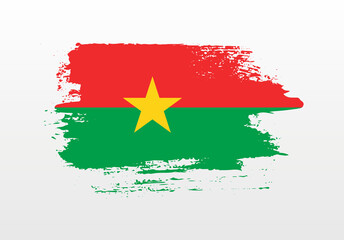 Modern style brush painted splash flag of Burkina Faso with solid background