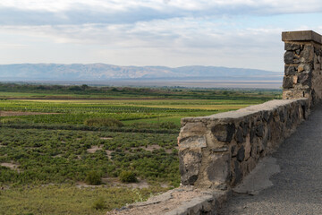 Fototapeta premium Part of the fortress wall and mountain view in Armenia.