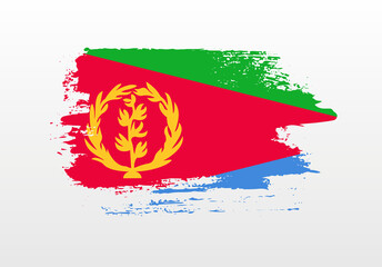 Modern style brush painted splash flag of Eritrea with solid background