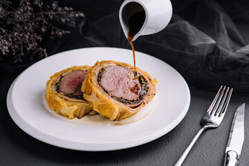 Fillet wellington in puff pastry on plate