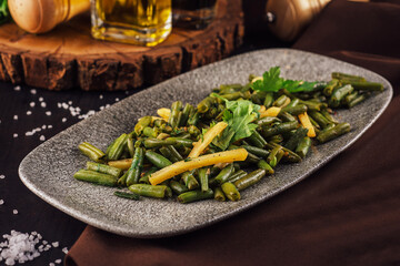 Fried wok green beans with onions and spices