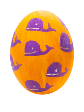 Orange easter egg with a drawing of whales