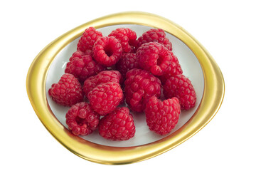 Group of raspberries placed on a golden dish