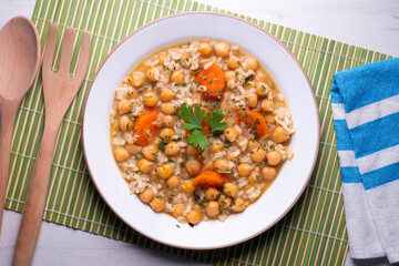 Chickpea stew with rice and carrots. Typical Spanish gastronomy dish.