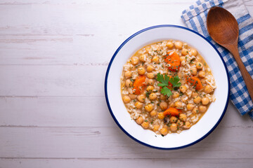 Chickpea stew with rice and carrots. Typical Spanish gastronomy dish.