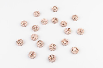 Heap of medicine colored pills, tablets on a white background