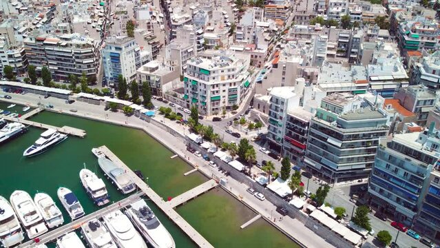 Aerial Drone View on Piraeus Greece above Harbour Port Yachts Boats Real Estates during summer sunny day