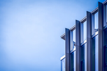Detail of a modern building against a blue sky, use as a background