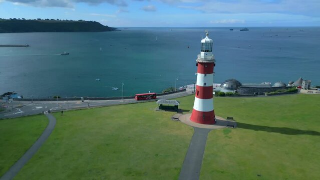 Plymouths Smeaton's Tower Lighthouse on Plymouth Hoe, Devon, England, UK. A beautiful landmark on a glorious summers day. Drone Video. 30fps.