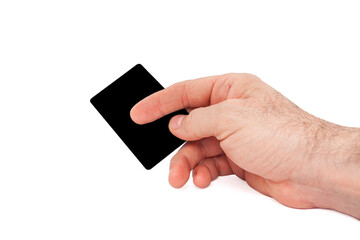 The man is holding a credit card in his hand.