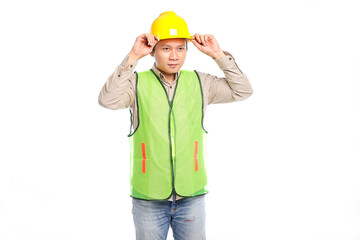 Young asian male construction worker wearing yellow safety helmet isolated on white background