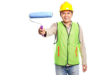 young asian man wearing yellow hard hat and work safety clothing holding paint roller brush isolated on white background