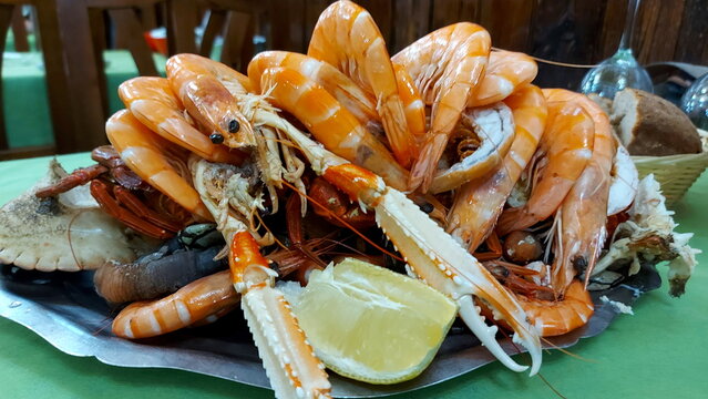 A large plate of different seafood in an old pub in Madrid, Seafood platter with crabs, shrimps, crabs and crawfish