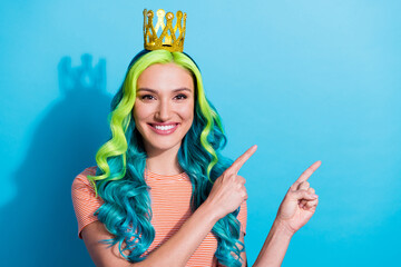 Photo of charming lady with tiara on head promote recommend product ad isolated on blue color...