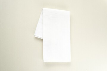 White empty kitchen towel mockup, blank waffle tea towel, minimal composition, top view.