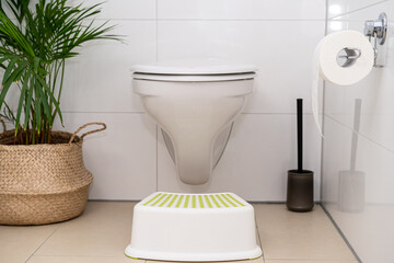 Foot lifter for posture suitable for defecation in the toilet.  Healthy positions for defecate.