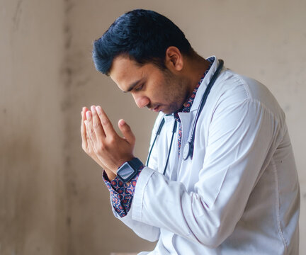 South Asian Young Male Muslim Doctor In Prayer Positions 